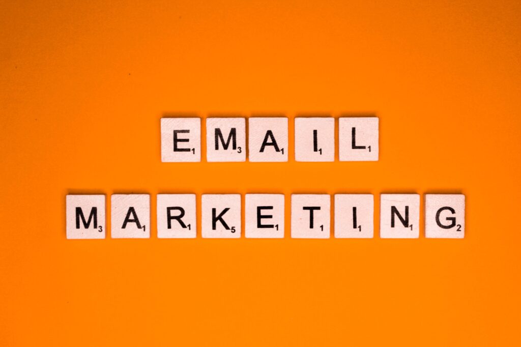 Email marketing scrabble letters word on a orange background
